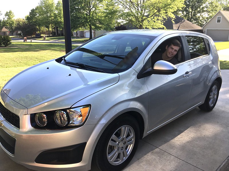 man in new car